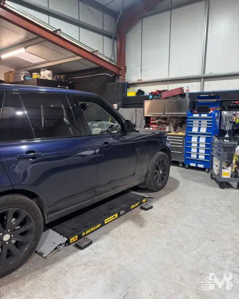 A Range Rover on the scissor lift, up for a service and MOT preparation