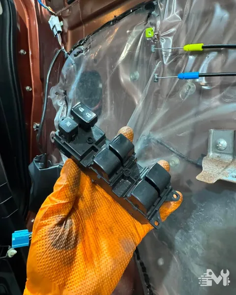 A window switch pack taken out of a car door for testing